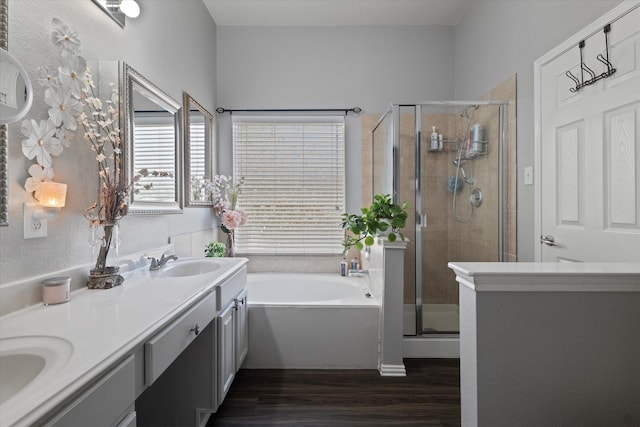 bathroom featuring vanity, hardwood / wood-style flooring, and independent shower and bath