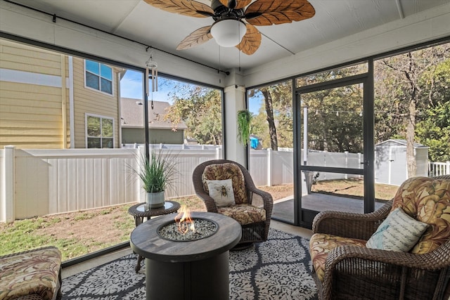 sunroom featuring ceiling fan