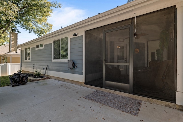 entrance to property with a patio