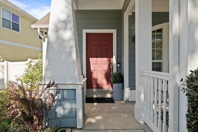 view of exterior entry with a porch