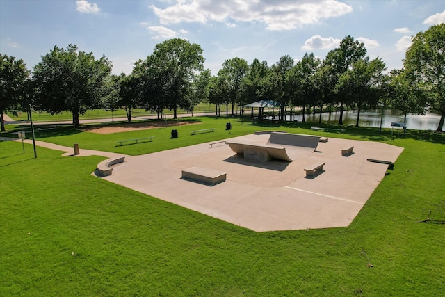 view of property's community featuring a lawn, a gazebo, and a water view