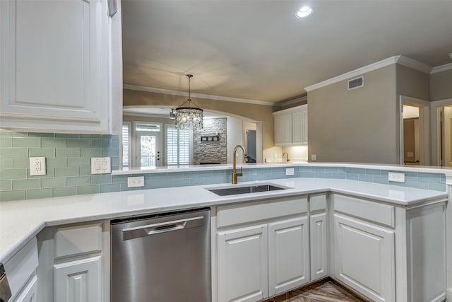 kitchen with sink, an inviting chandelier, stainless steel dishwasher, white cabinets, and ornamental molding