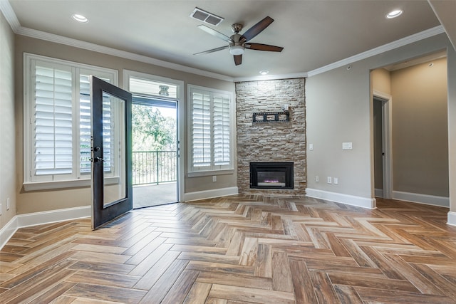 unfurnished living room featuring ceiling fan, ornamental molding, a fireplace, and light parquet floors