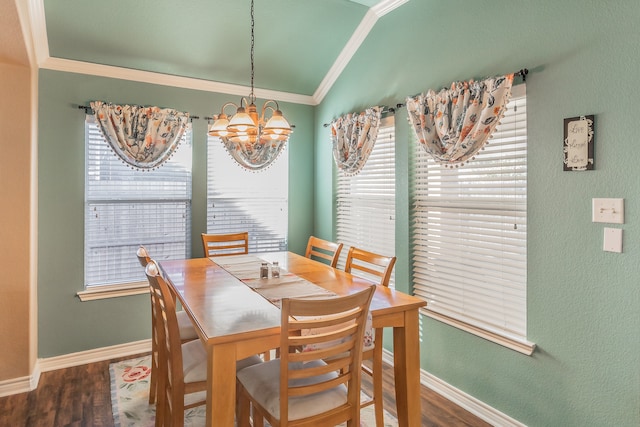 dining area with vaulted ceiling, crown molding, dark hardwood / wood-style floors, and a notable chandelier