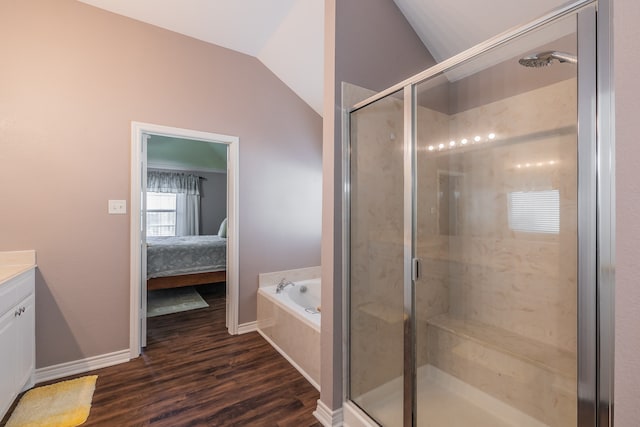 bathroom featuring separate shower and tub, vanity, lofted ceiling, and hardwood / wood-style flooring