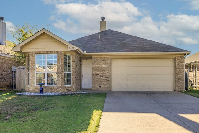 single story home featuring a garage and a front lawn