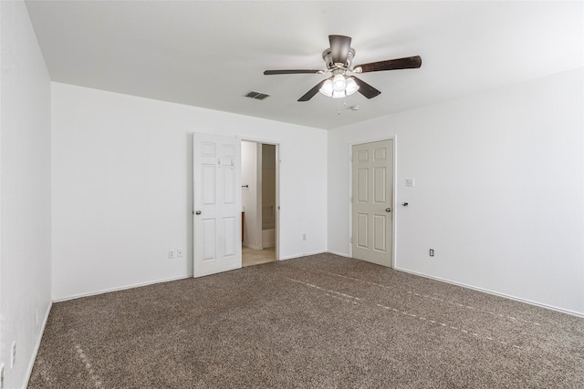 carpeted empty room featuring ceiling fan