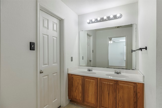 bathroom featuring ceiling fan and vanity