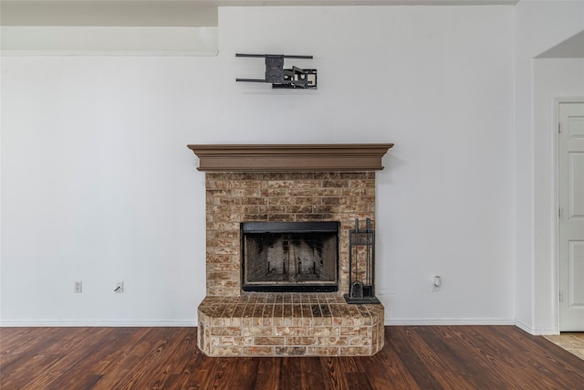 room details with a fireplace and hardwood / wood-style floors