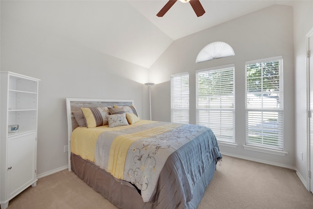 carpeted bedroom featuring ceiling fan and lofted ceiling