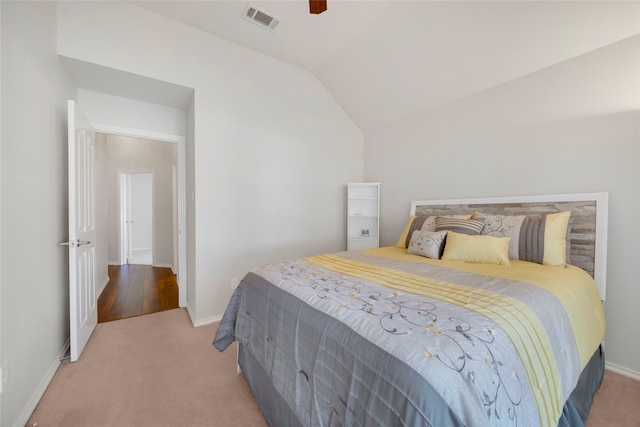 carpeted bedroom featuring vaulted ceiling and ceiling fan