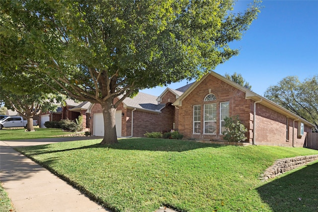 single story home featuring a front yard and a garage