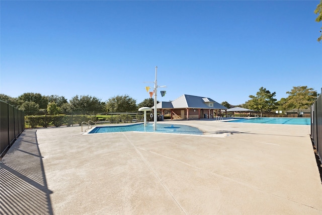 view of swimming pool with a patio area