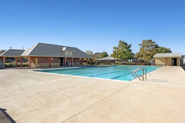 view of swimming pool with a gazebo and a patio area