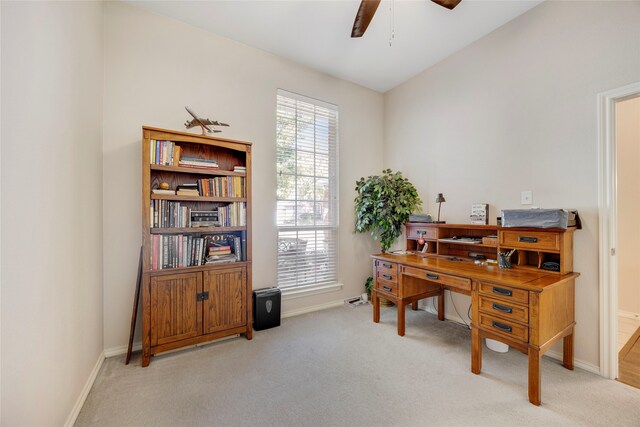 carpeted office with ceiling fan