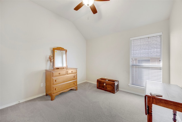 bedroom featuring ceiling fan, lofted ceiling, and light carpet