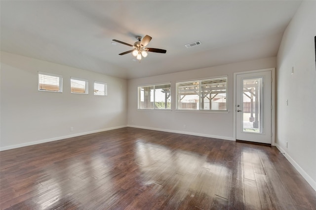 interior space featuring ceiling fan and dark hardwood / wood-style flooring