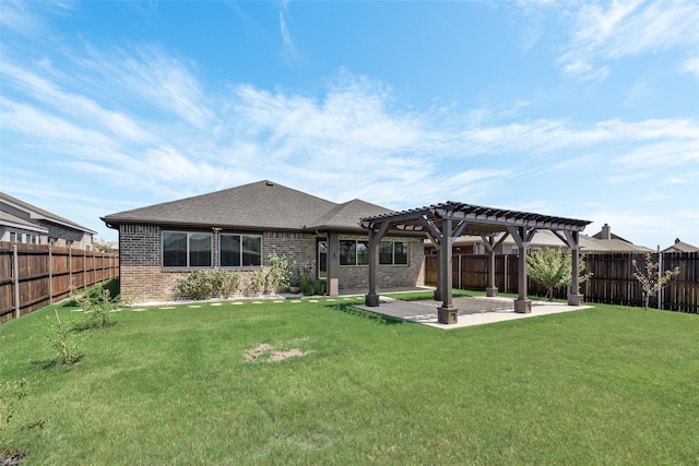 back of house featuring a patio area, a pergola, and a yard