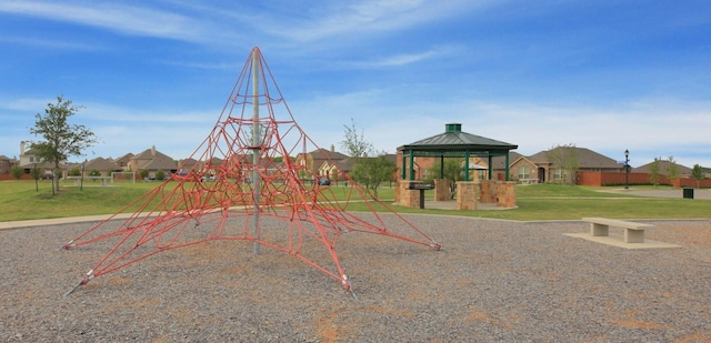 view of jungle gym with a gazebo and a lawn