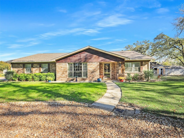 ranch-style home featuring a front yard