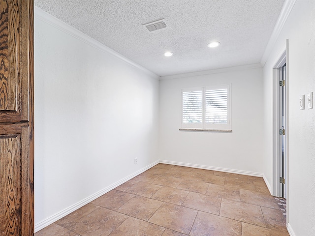 empty room with crown molding and a textured ceiling