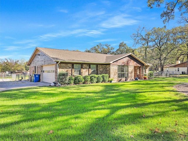 single story home featuring a garage and a front yard