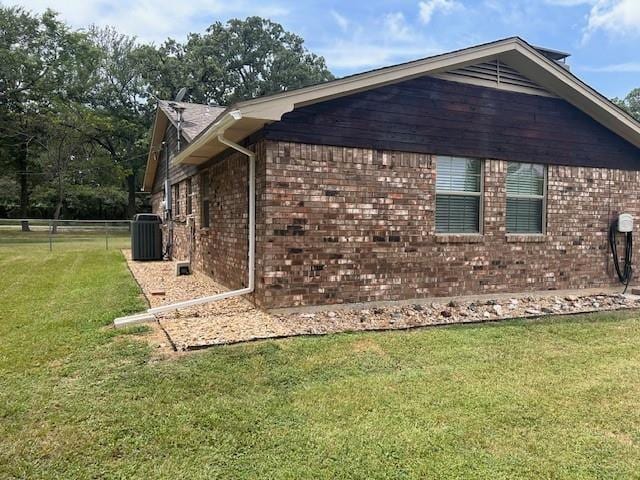 305 Dena, Krugerville, TX 76227 - view of side of home with brick siding and cooling unit