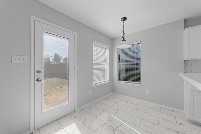 unfurnished dining area with a wealth of natural light