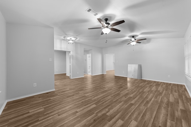 unfurnished living room featuring dark hardwood / wood-style flooring and ceiling fan