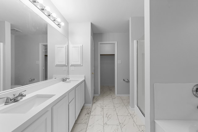 bathroom featuring vanity and walk in shower