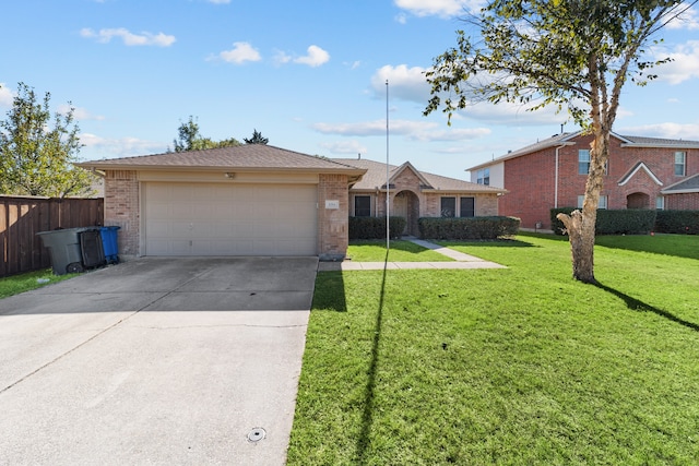 ranch-style house featuring a front yard and a garage