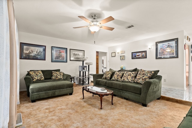 carpeted living room featuring ceiling fan