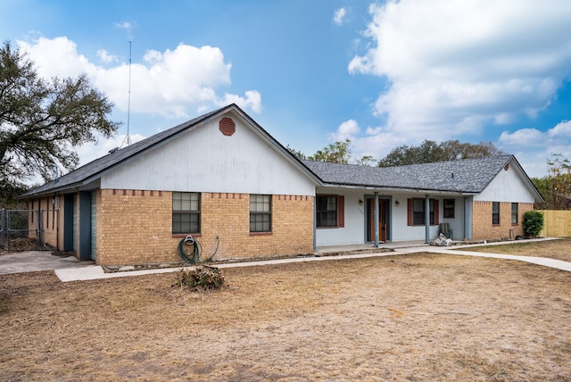 single story home featuring covered porch