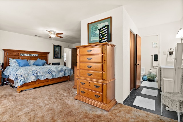 bedroom featuring ceiling fan and dark colored carpet