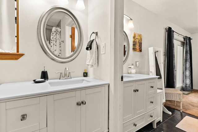 bathroom featuring tile patterned flooring and vanity