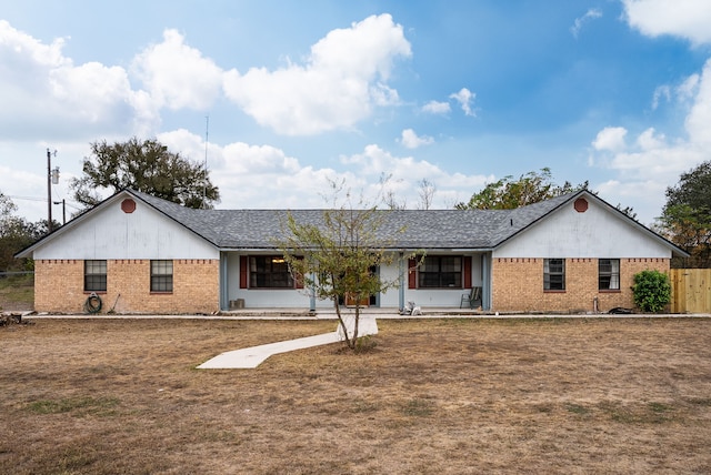 single story home with a porch