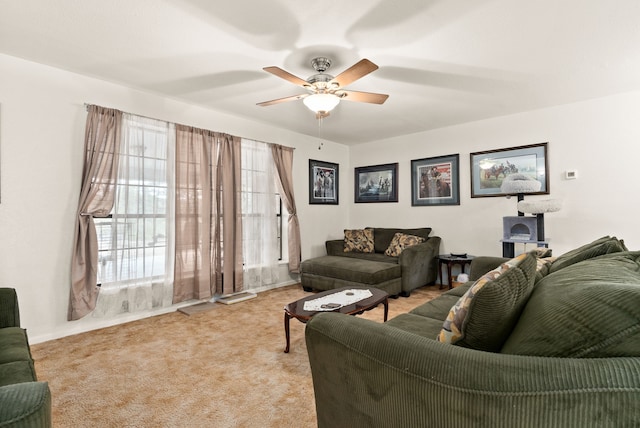 living room with ceiling fan and light carpet