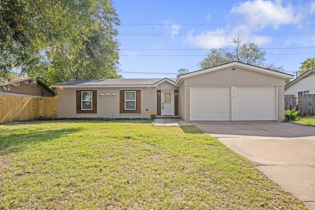 ranch-style house featuring a garage and a front lawn