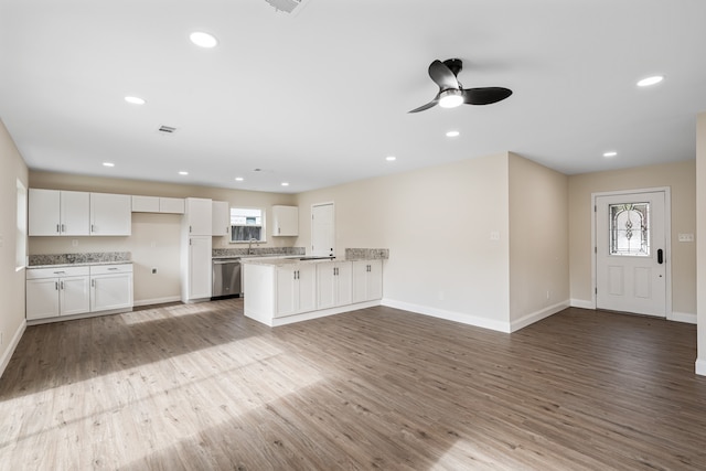 kitchen featuring white cabinets, dishwasher, and a healthy amount of sunlight