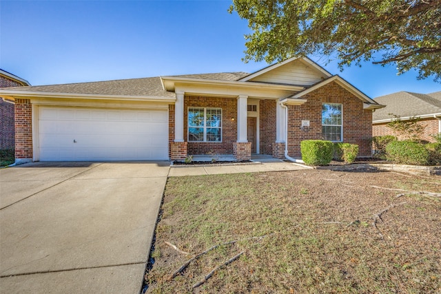 view of front of home featuring a porch and a garage