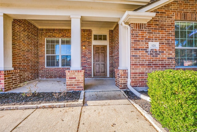 property entrance featuring a porch