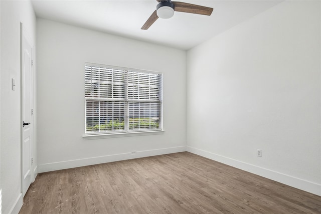 empty room featuring ceiling fan and light wood-type flooring