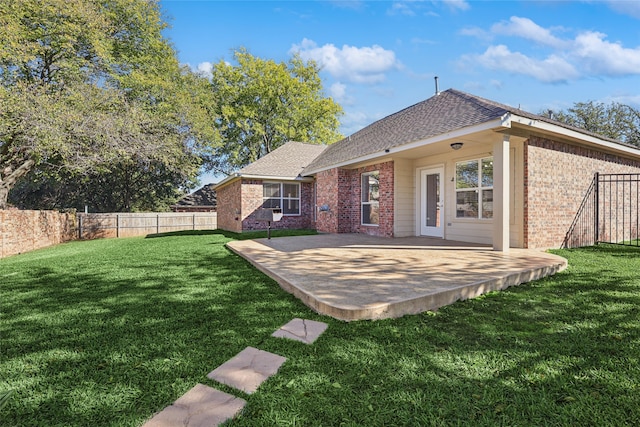 back of property featuring a lawn