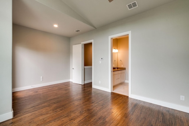 empty room featuring dark hardwood / wood-style flooring