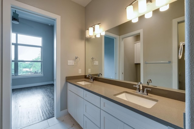 bathroom featuring hardwood / wood-style floors and vanity