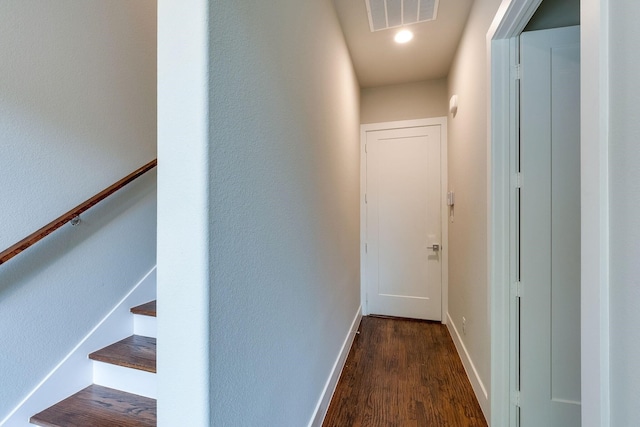 corridor with dark wood-type flooring