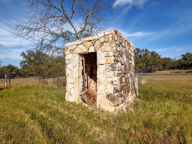 view of outbuilding with a rural view