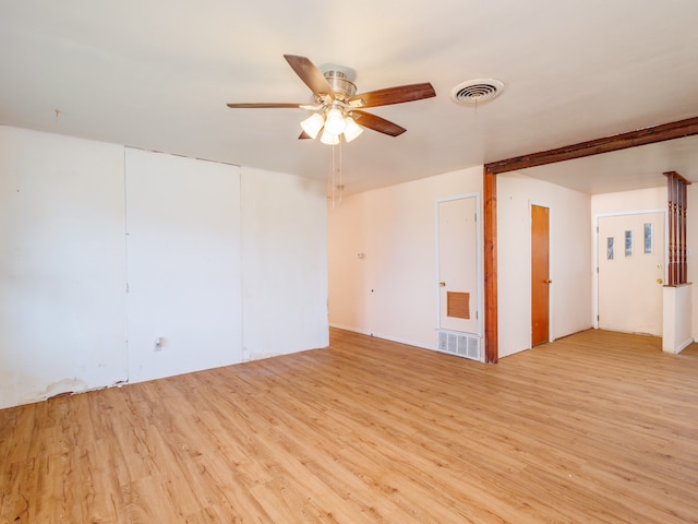 empty room featuring light hardwood / wood-style flooring and ceiling fan