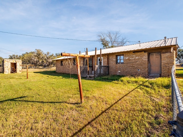 back of house with a yard