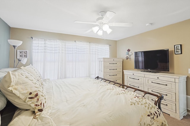 bedroom featuring ceiling fan and light colored carpet